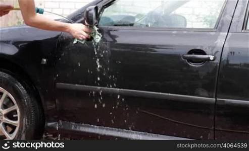 teenager washing the car