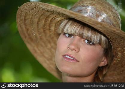 Teenager wearing straw hat