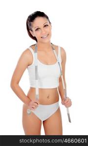Teenager with tape measure in underwear isolated on a white background
