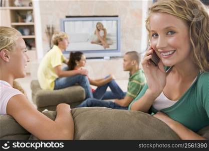 Teenagers Hanging Out In Front Of Television