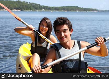 Teenagers kayaking