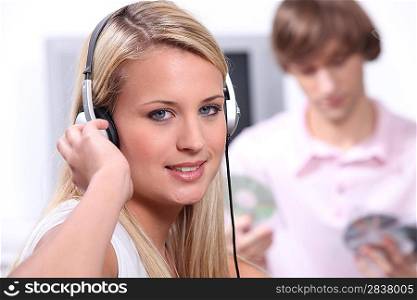 Teenagers listening to music on headphones