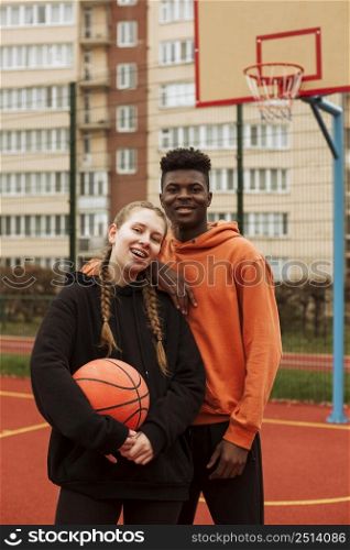 teenagers playing basketball outdoors 4