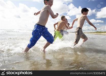 Teenagers playing on beach