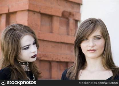 Teenagers Portrait On The Brick Background