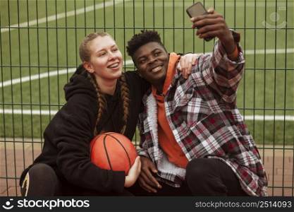 teenagers posing basketball field 6