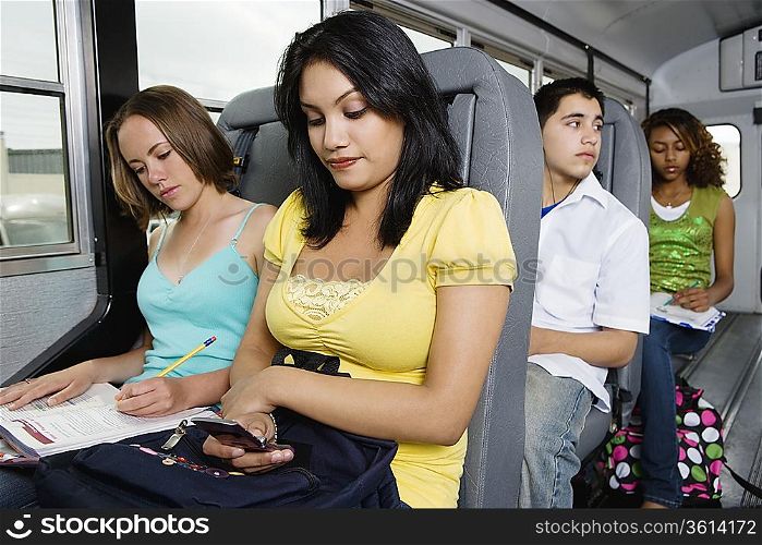 Teenagers Riding School Bus