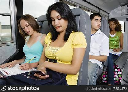 Teenagers Riding School Bus