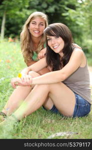 Teenagers sitting on the grass