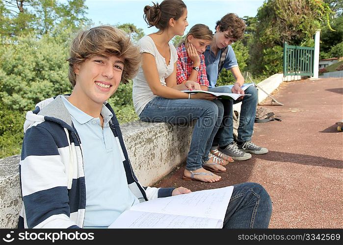 Teenagers studying outside the class