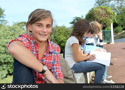 Teenagers studying outside the class