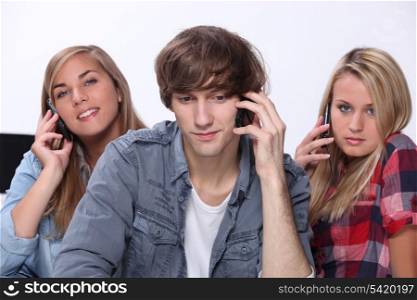Teenagers talking on cellphones