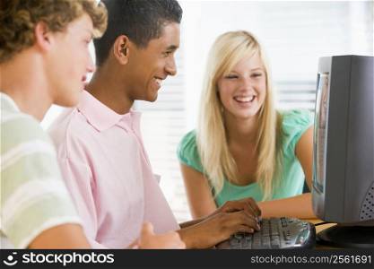 Teenagers Using Desktop Computer Together