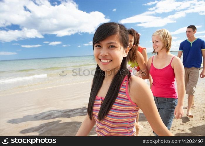 Teenagers walking on beach