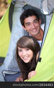Teens leaning in tent