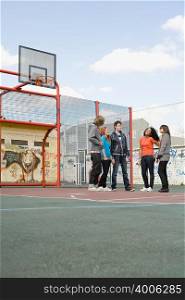Teens on basketball court