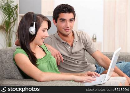 Teens sitting on couch