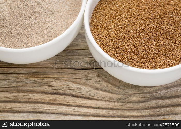 teff grain and flour in small ceramic bowls against grained wood background