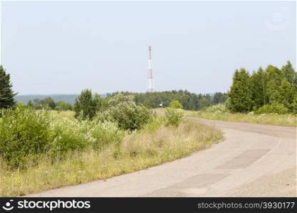 Telecommunication cell tower. Telecommunication tower and radio cell antenna outside of town