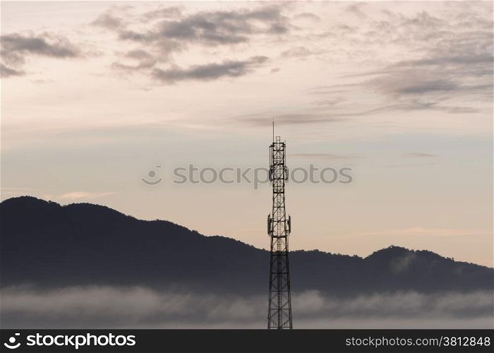 Telecommunication tower and sunset sky background