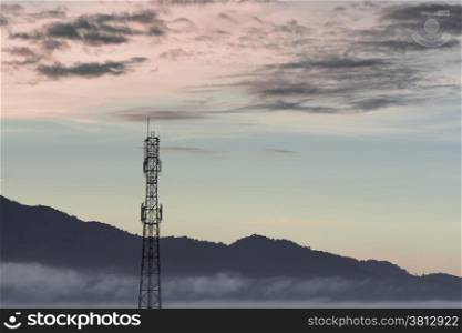 Telecommunication tower and sunset sky background