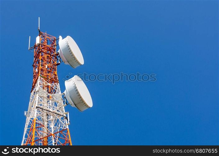 Telecommunication tower on blue sky blank background. Used to transmit television and telephony signal