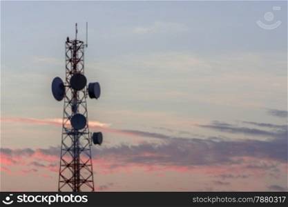 Telecommunication tower structure with sunset sky background