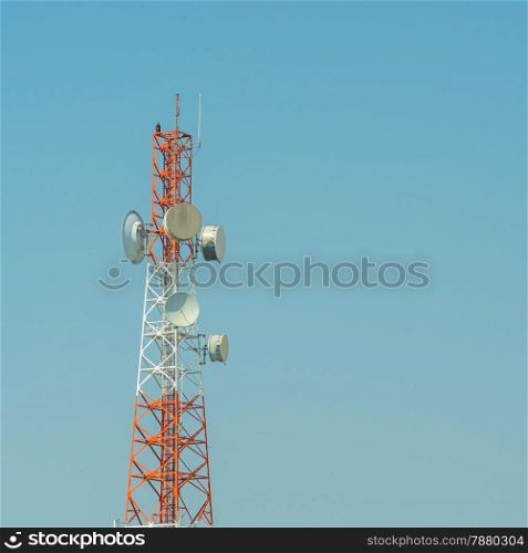 Telecommunication tower using to transmit television signals with a blue sky background
