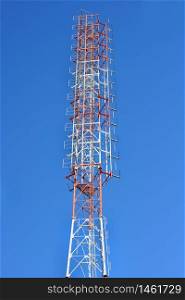 Telecommunication tower with a sunlight. Used to transmit television signals.