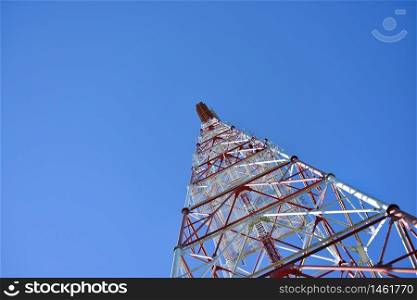 Telecommunication tower with a sunlight. Used to transmit television signals.
