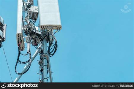 Telecommunication tower with clear blue sky background. The antenna against the blue sky. Radio and satellite pole. Communication technology. Telecommunication industry. Mobile or telecom 4g network.