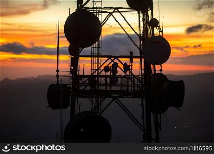 Telecommunication transmitting tower at dawn on top mountain. Telecommunication transmitting tower at dawn on top