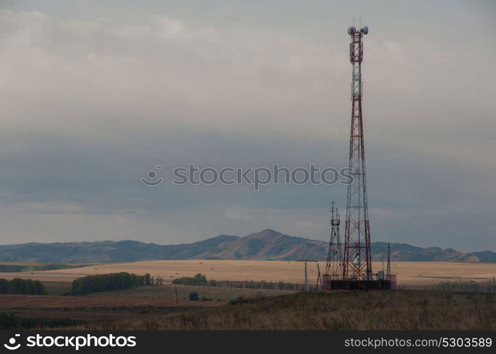 Telecommunications cell phone tower. Telecommunications cell phone tower with antennas in a mountain location.