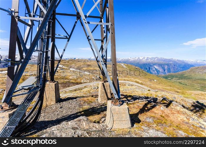 Telecommunications tower mast wireless technology in mountains. Telecommunications tower in mountains