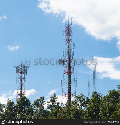 Telecommunications towers Located high in the mountains are covered with trees.