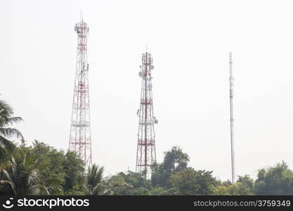 Telecommunications transmission towers Signals in space communication networks. There are a lot of tree cover in the area.