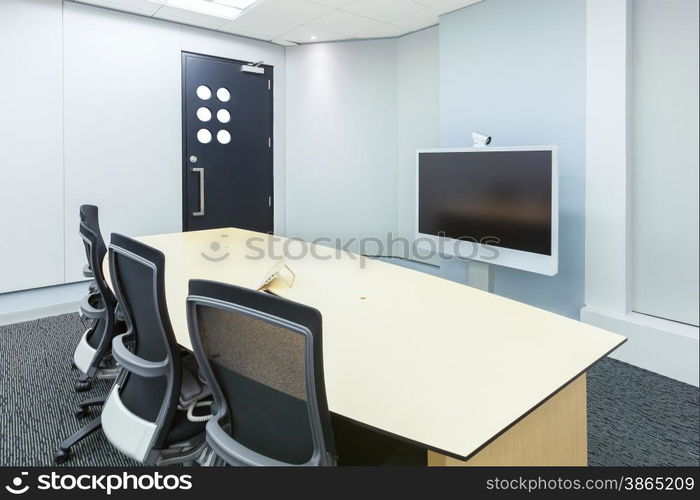 teleconferencing, video conference and telepresence business meeting room with display screen