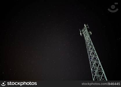 Telephone towers with stars as background at night