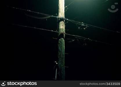 Telephone wires on a foggy night