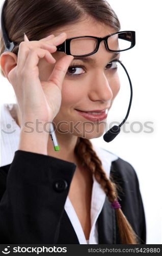 Telephonist raising her glasses