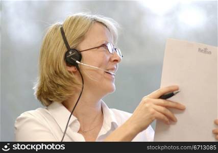 telesales person working with papers