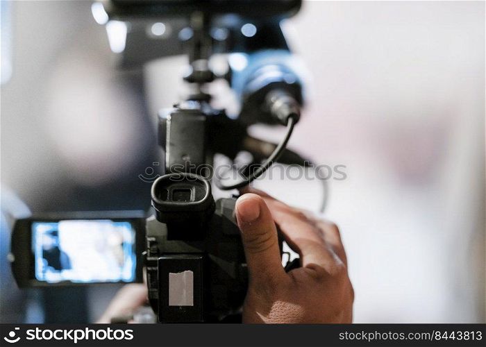 Television camera at an evening press conference 