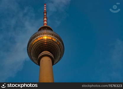 Television tower in Alexanderplatz in Berlin, The sun of the sunset is mirrored.