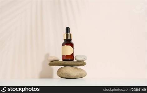 template with brown glass bottle with pipette on a beige background. Collagen skin. Aromatherapy concept. Mockup skincare cosmetic product.