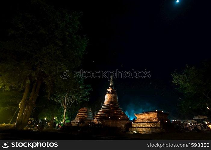 Temple at the Sukhothai Historical Park in the full moon night during the Loykratong festival, sukhothai Thailand