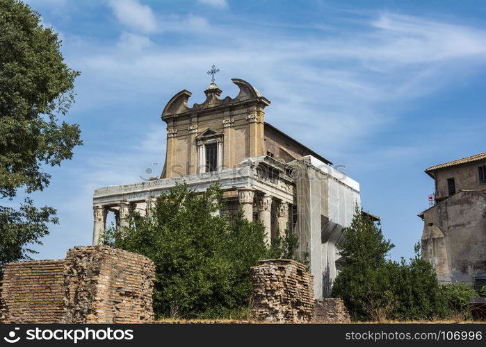 Temple Emperor Antonius and Wife Faustina with Corinthian Columns at Roman Forum, Rome, Italy. Temple Emperor Antonius and Wife Faustina with Corinthian Columns at Roman Forum, Rome, Italy. It is an ancient Roman temple adapted as a Roman Catholic church.