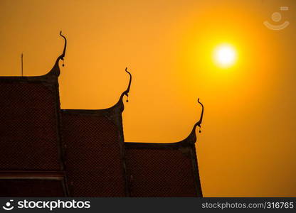 temple in thailand with sunset