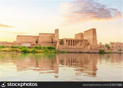 Temple of Isis on Philae Island at sunset, view from the Nile, Aswan, Egypt.