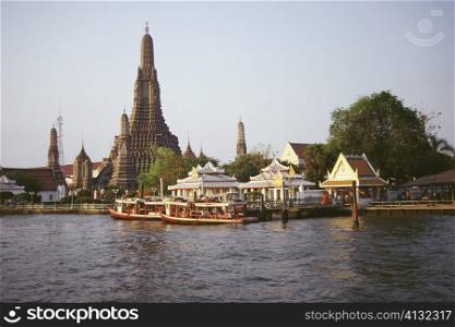 Temple on the bank of a river, Wat Arun, Bangkok, Thailand