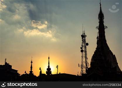 Temple silhouette with spire at sunset in southeast Asia, Myanmar (Burma)